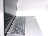 two laptops sitting side by side on a white surface