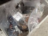 a white box filled with assorted items on the floor