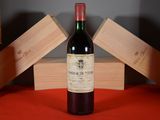 a bottle of wine that is sitting on a table