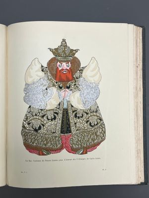 an open book with a drawing of an angel on it