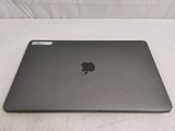 an apple macbook pro laptop computer sitting on a white surface