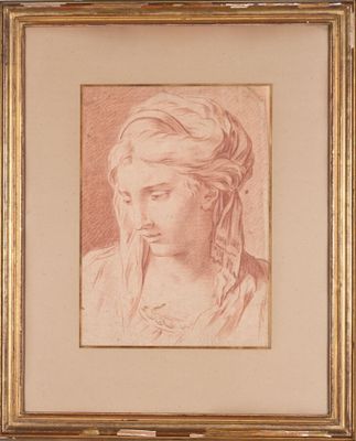 un dessin représentant la tête d'une femme dans un cadre doré