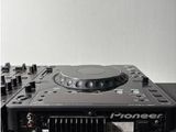 a black and white photo of a dj controller