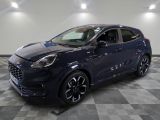 the new ford kadgo is parked in a showroom