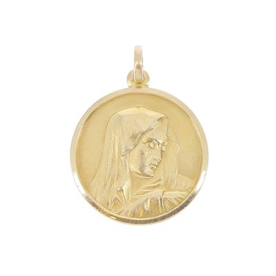 l'image d'une médaille d'or sur laquelle figure le visage d'une femme