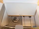a white box with a couple of cables inside of it