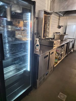 an image of a commercial kitchen with stainless steel appliances