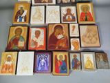 wooden blocks with religious images on them on a table