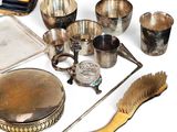 a lot of silver items that are on the table