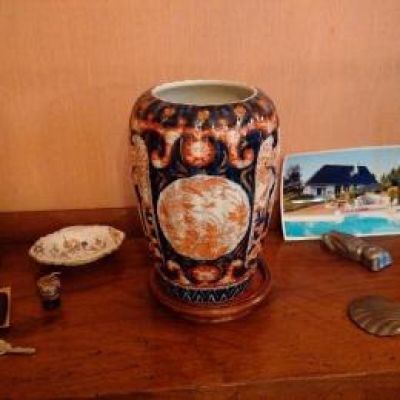 a vase that is sitting on a table with other items