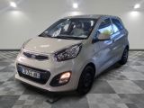 the small silver car is parked on a checkered floor