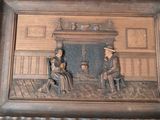 a picture of a picture of a man and a woman sitting in front of a fireplace