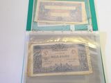 two bills in a clear plastic bag on a table