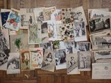 a lot of old photos on the floor of this room