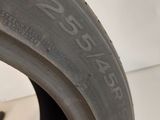 a close up of a tire on a white surface
