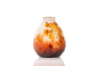a vase with a floral design on it on a white surface