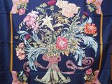 an image of a blue silk scarf with a bouquet of flowers on it
