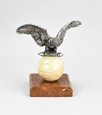an image of a statue of an eagle on a sphere