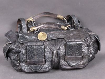 an image of a black purse with a gold buckle
