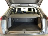 the back of a car with the trunk open and the seats down