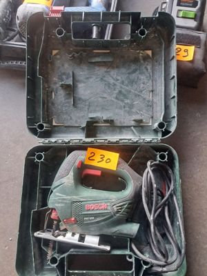 a box with tools in it sitting on the floor