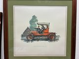 framed picture of an old car with a man in the driver ' s seat