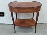 a small wooden table with a shelf on it
