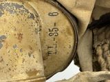 a close up view of a dirty motorcycle with a helmet on it