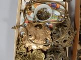 two boxes filled with assorted items sitting on a table
