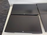 two laptops that are sitting on top of a table