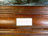a close up of a piece of wood with a label on it