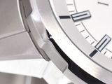 a close up view of a wrist watch with roman numerals