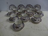 a lot of cups and saucers on a table
