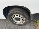 a white van that has a flat tire on it