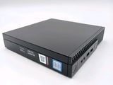 an image of a small black computer on a white surface