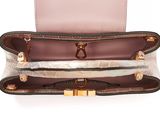 the inside of a pink purse with a gold clasp