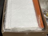 a box with a sheet of white paper in it