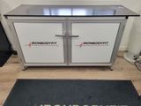 an image of a stainless steel cabinet with a door open