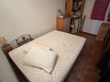 a mattress that is sitting on the floor in a room