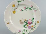 a white plate with a floral design on it