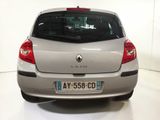 a silver car that is parked in a white room
