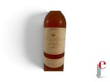 an image of a bottle of wine sitting on top of a white surface