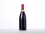a bottle of wine that is sitting on a table
