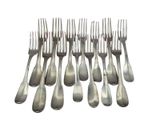 a lot of forks that are sitting on a table