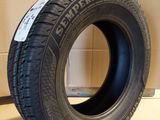 a close up of a tire on a cardboard box in a warehouse