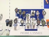 a lot of watches on display in a glass case