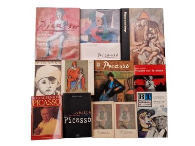 a lot of books that are sitting on a table