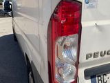 a white van that is parked in a parking lot