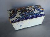 a white box with a blue and yellow design on it