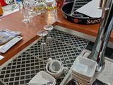 a table with a bunch of wine glasses and plates on it